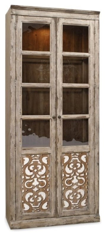 How adjustable shelves and touch lighting elevate the display of heirlooms in a Caramel Froth curio